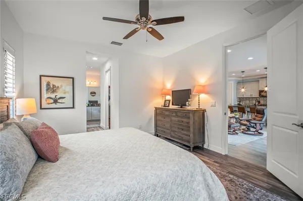a bedroom with furniture and a walk in closet