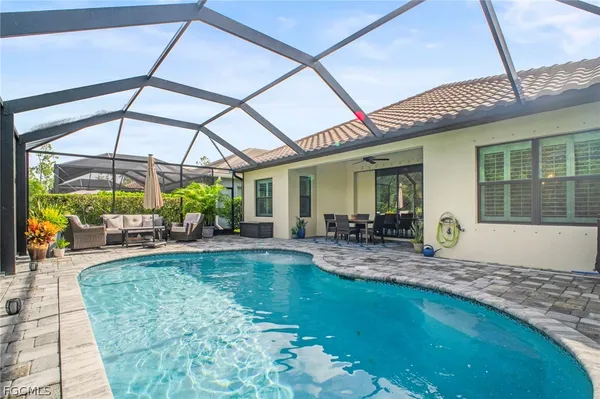 a view of a swimming pool with a patio