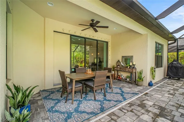 a dining room with furniture a chandelier and a rug
