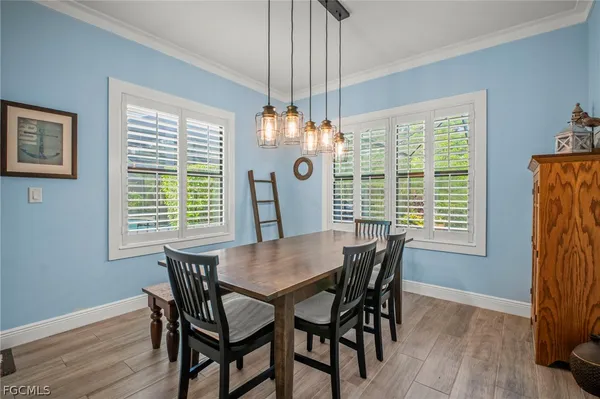 a view of a dining room with furniture window and wooden floor