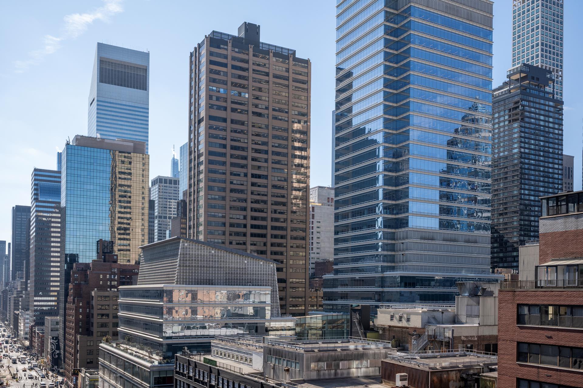 200 East 61st Street, Unit 14B Manhattan, NY 10065 - Photo 1 of 15 a front view of a building with glass windows