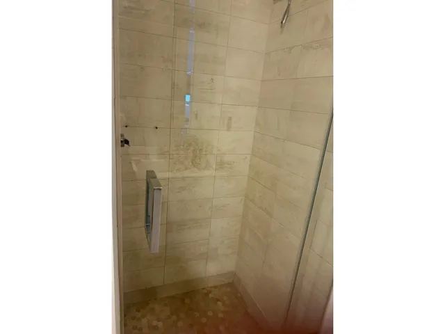 a bathroom with a sink toilet tub and shower