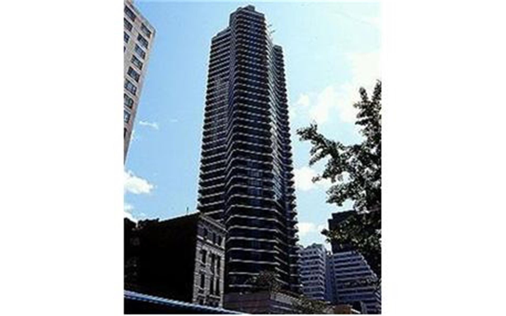 200 East 61st Street, Unit 14B Manhattan, NY 10065 - Photo 9 of 15 a view of a multi story building