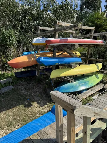 a patio with swimming pool table and chairs