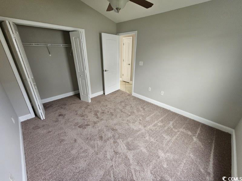 684 Rambler Court Myrtle Beach, SC 29588 - Photo 13 of 15 Unfurnished bedroom with vaulted ceiling, carpet floors, a closet, and ceiling fan