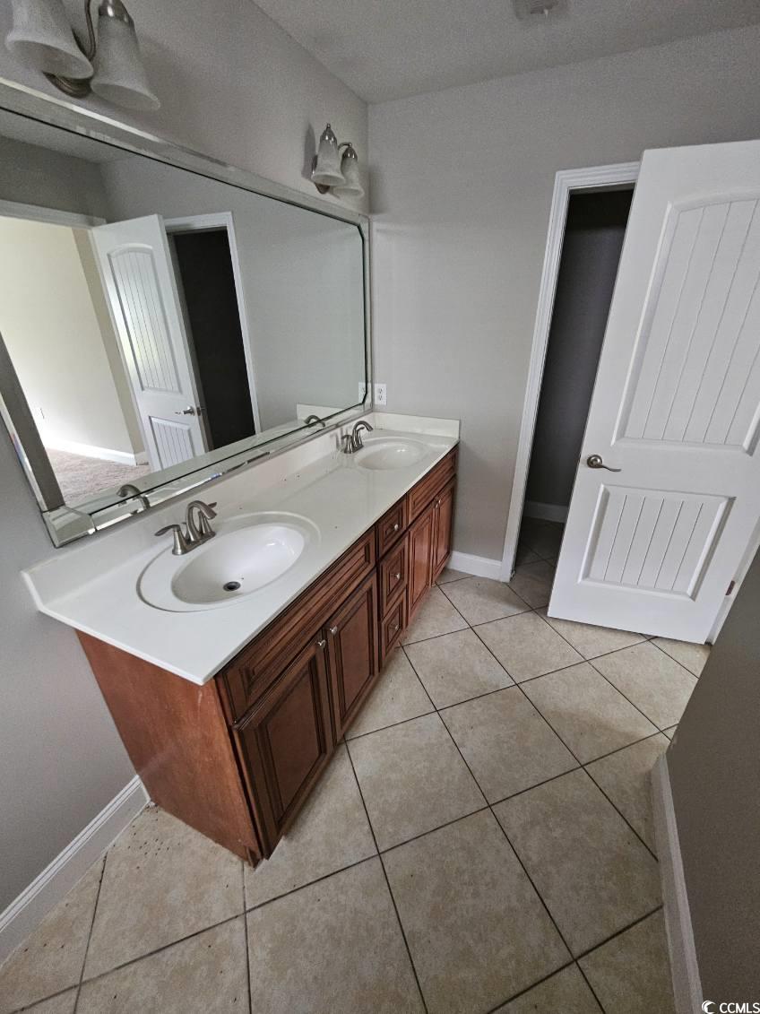 684 Rambler Court Myrtle Beach, SC 29588 - Photo 2 of 15 Full bathroom featuring double vanity and light tile patterned floors