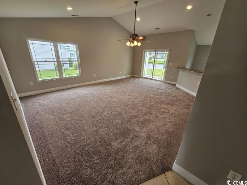 684 Rambler Court Myrtle Beach, SC 29588 - Photo 10 of 15 Unfurnished living room featuring recessed lighting, vaulted ceiling, light colored carpet, and a ceiling fan