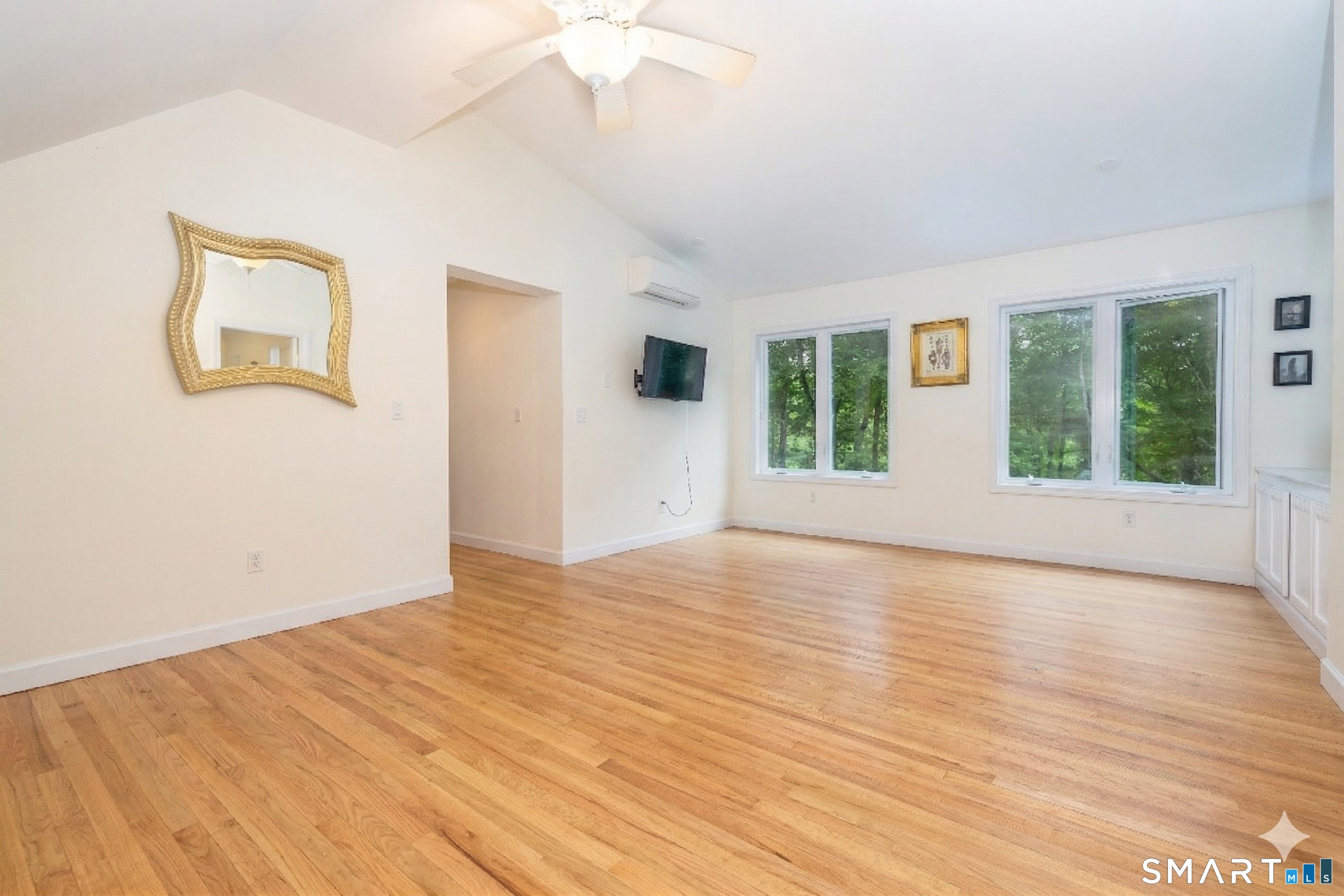 235 White Deer Rock Road, Unit GUEST Woodbury, CT 06798 - Photo 11 of 19 a view of an empty room with a window and wooden floor