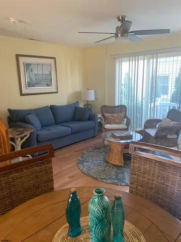 a living room with furniture and a rug