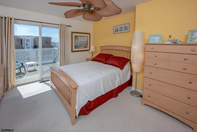 a bed room with a bed and a chandelier