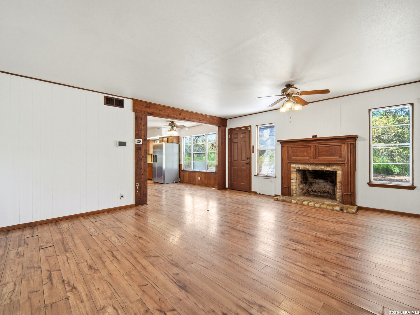 300 Ave M Hondo, TX 78861 - Photo 11 of 37 a view of an empty room with wooden floor fireplace and a window
