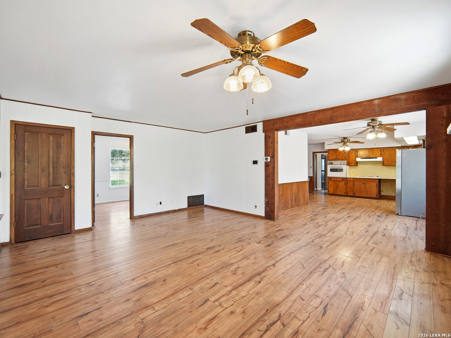300 Ave M Hondo, TX 78861 - Photo 12 of 37 wooden floor in an empty room with a window
