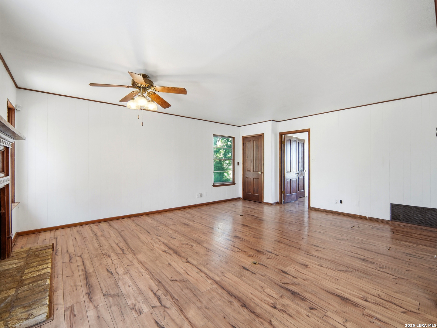 300 Ave M Hondo, TX 78861 - Photo 13 of 37 wooden floor in an empty room with a window