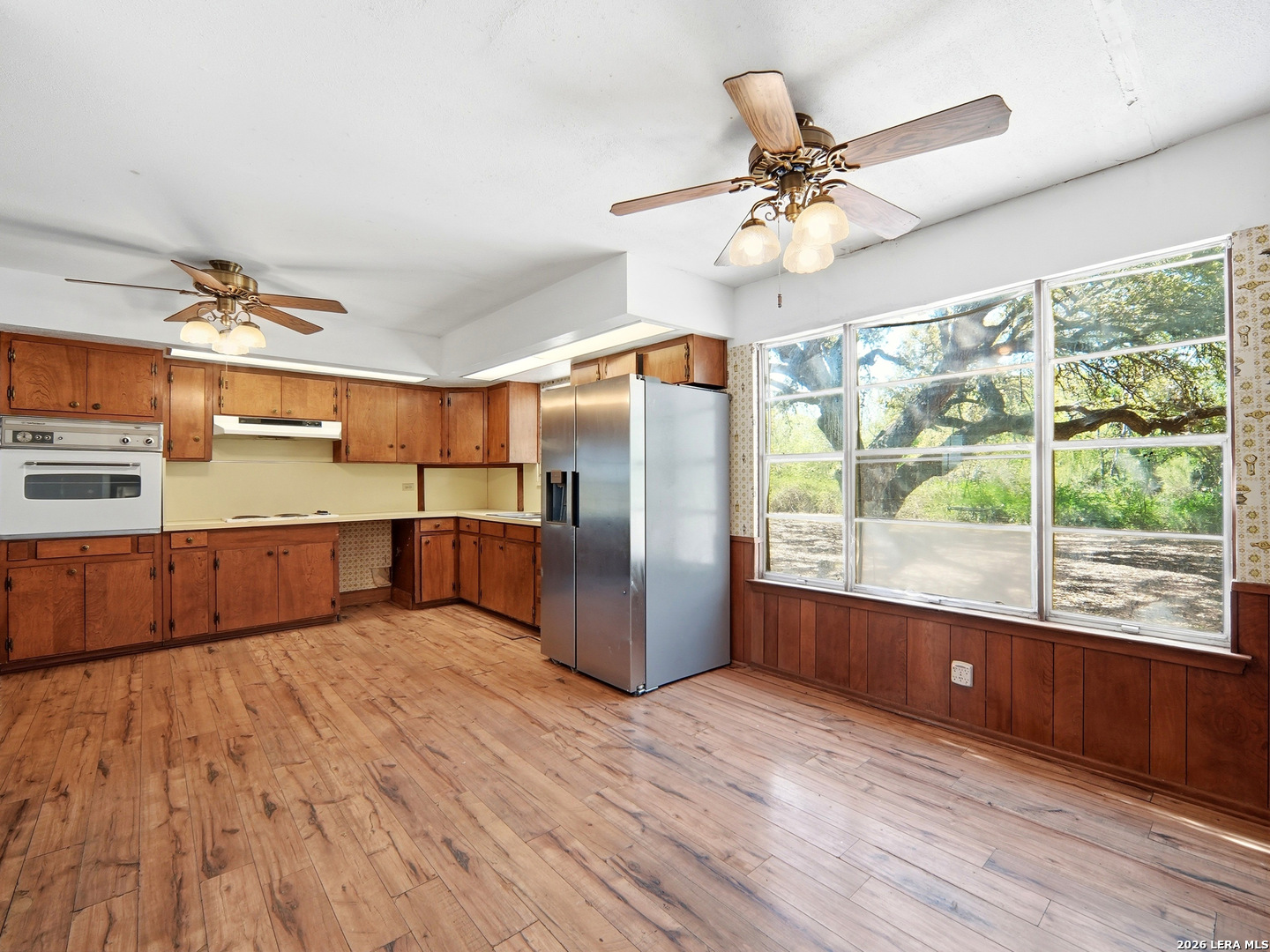 300 Ave M Hondo, TX 78861 - Photo 14 of 37 a kitchen with stainless steel appliances granite countertop a refrigerator a sink and a stove