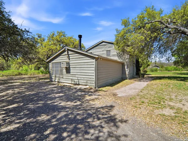 a view of a backyard of the house