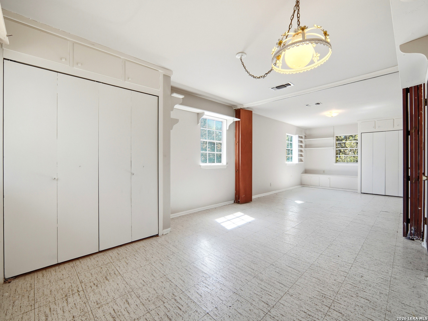 300 Ave M Hondo, TX 78861 - Photo 22 of 37 a view of an empty room with window and chandelier fan