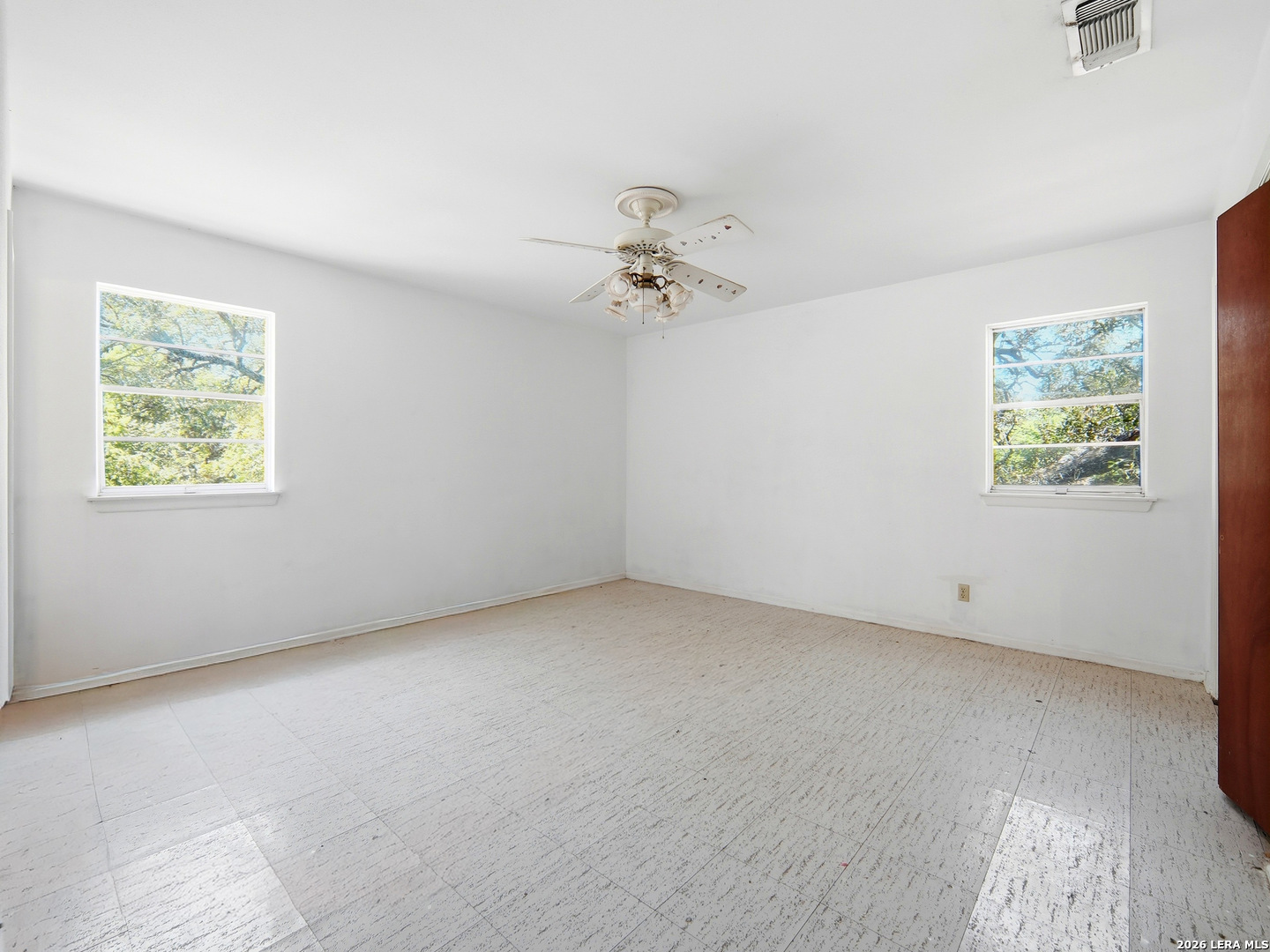 300 Ave M Hondo, TX 78861 - Photo 25 of 37 an empty room with a window and a ceiling fan
