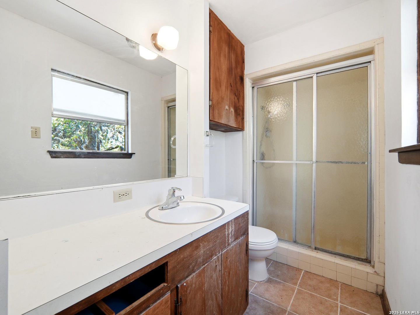 300 Ave M Hondo, TX 78861 - Photo 29 of 37 a bathroom with a sink a toilet and shower