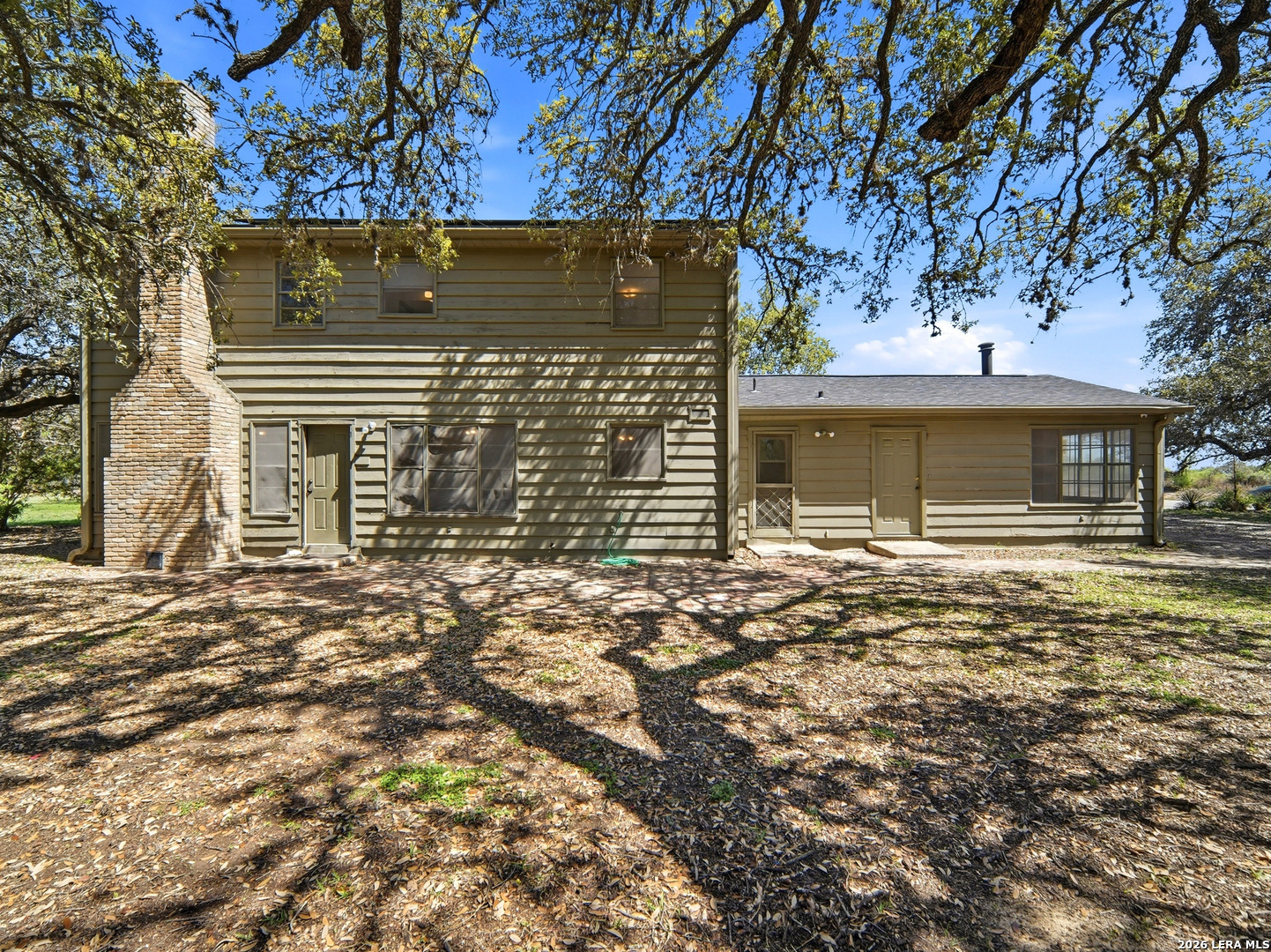300 Ave M Hondo, TX 78861 - Photo 7 of 37 a front view of a house with a garden