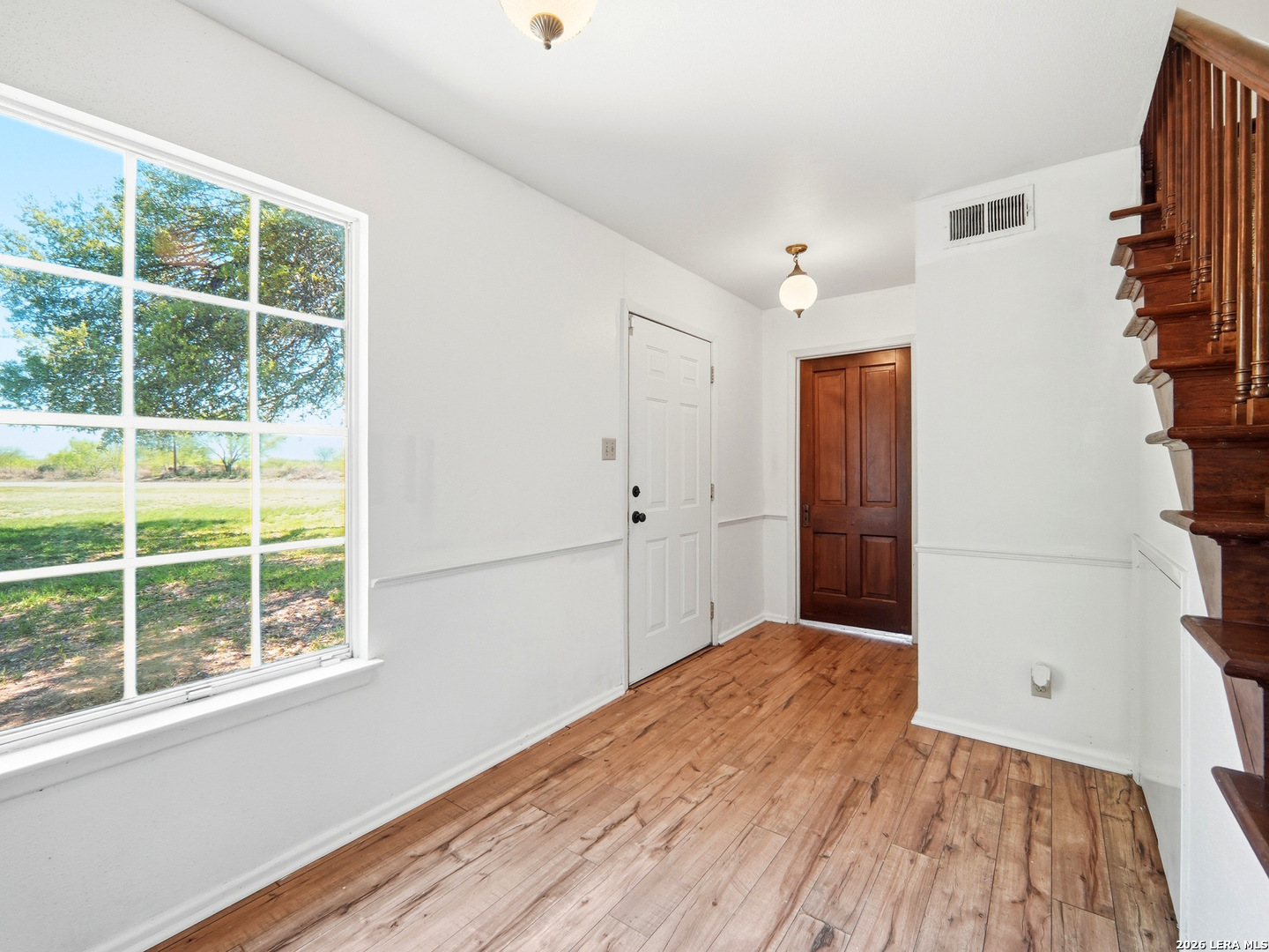 300 Ave M Hondo, TX 78861 - Photo 9 of 37 an empty room with windows and entrance