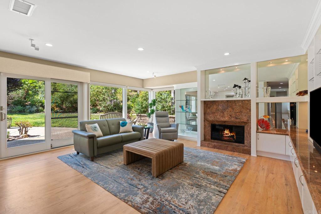 1229 Caminito Graciela Encinitas, CA 92024 - Photo 15 of 34 a living room with furniture and a fireplace