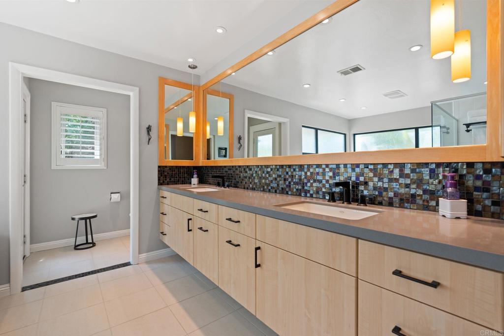 1229 Caminito Graciela Encinitas, CA 92024 - Photo 18 of 34 a bathroom with a sink and a mirror