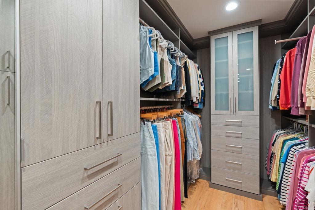 1229 Caminito Graciela Encinitas, CA 92024 - Photo 20 of 34 a view of walk in closet with clothes