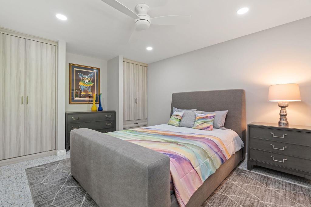1229 Caminito Graciela Encinitas, CA 92024 - Photo 21 of 34 a bedroom with a bed and a night stand