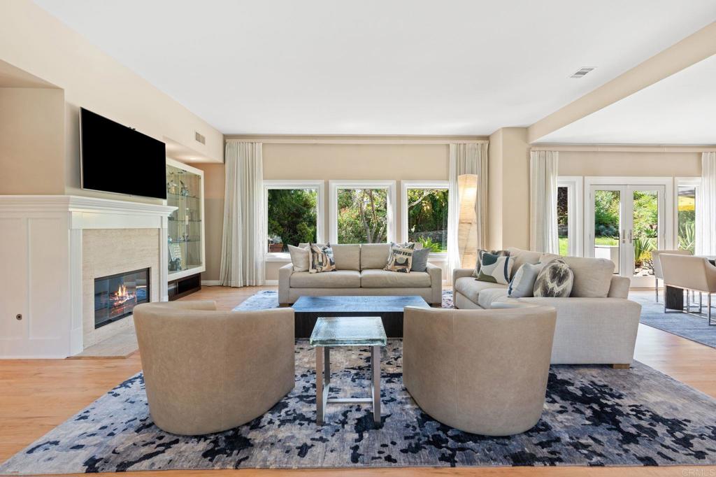 1229 Caminito Graciela Encinitas, CA 92024 - Photo 9 of 34 a living room with fireplace furniture and a flat screen tv