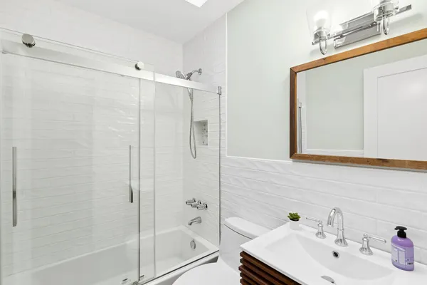 a bathroom with a sink and shower