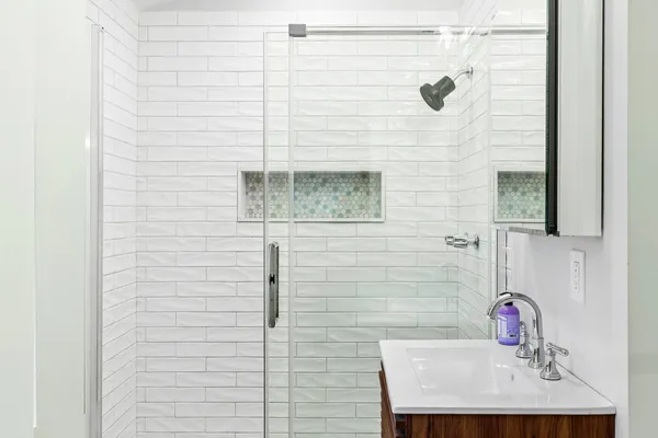 a bathroom with a sink and a mirror