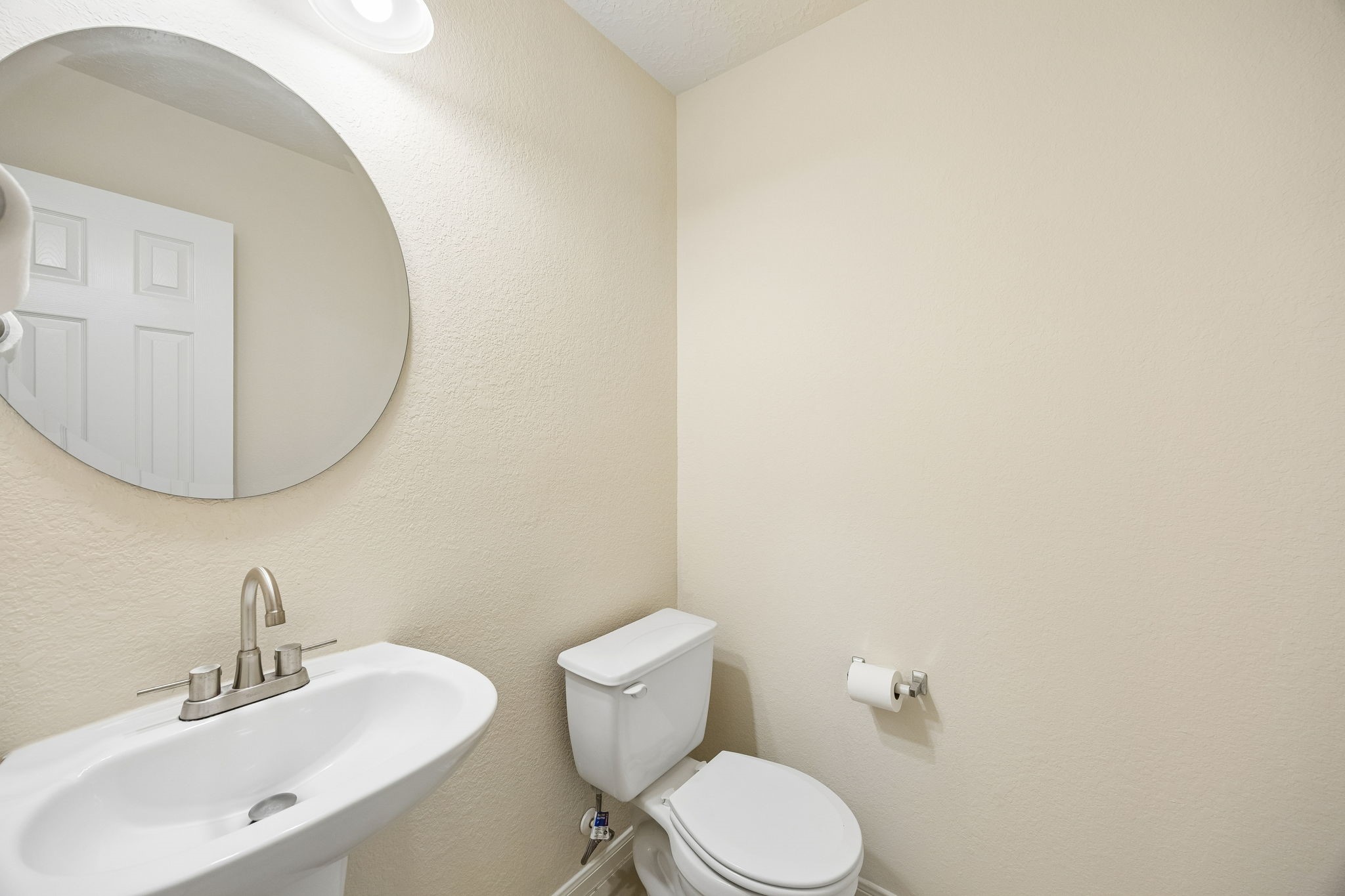 29711 Legends Green Drive Spring, TX 77386 - Photo 13 of 28 a bathroom with a sink a mirror and a toilet