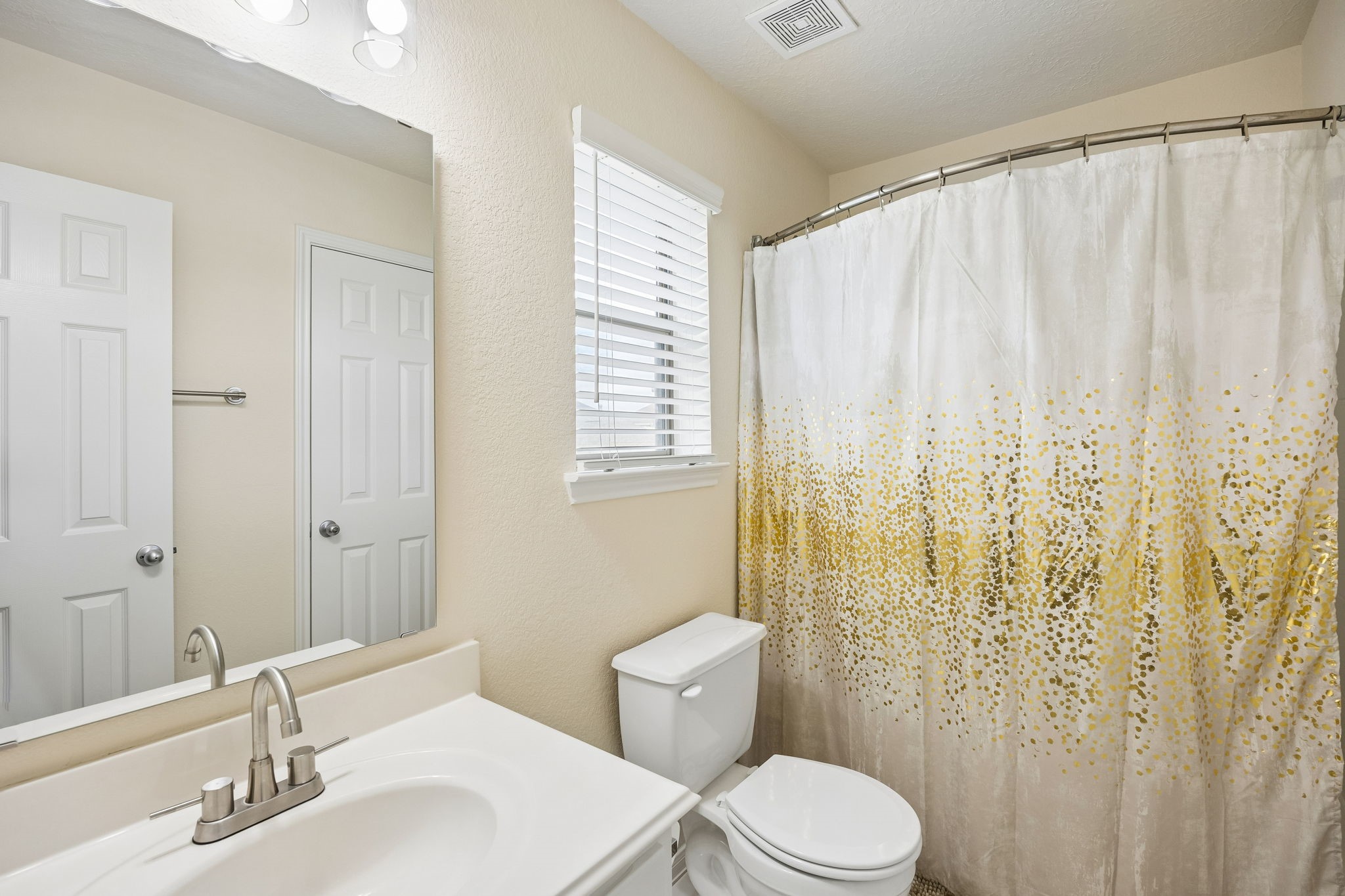 29711 Legends Green Drive Spring, TX 77386 - Photo 16 of 28 a bathroom with a sink a toilet and shower curtain