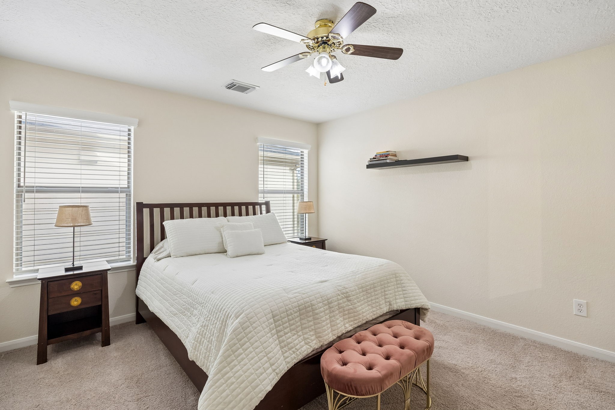 29711 Legends Green Drive Spring, TX 77386 - Photo 18 of 28 a bedroom with a bed and a chandelier