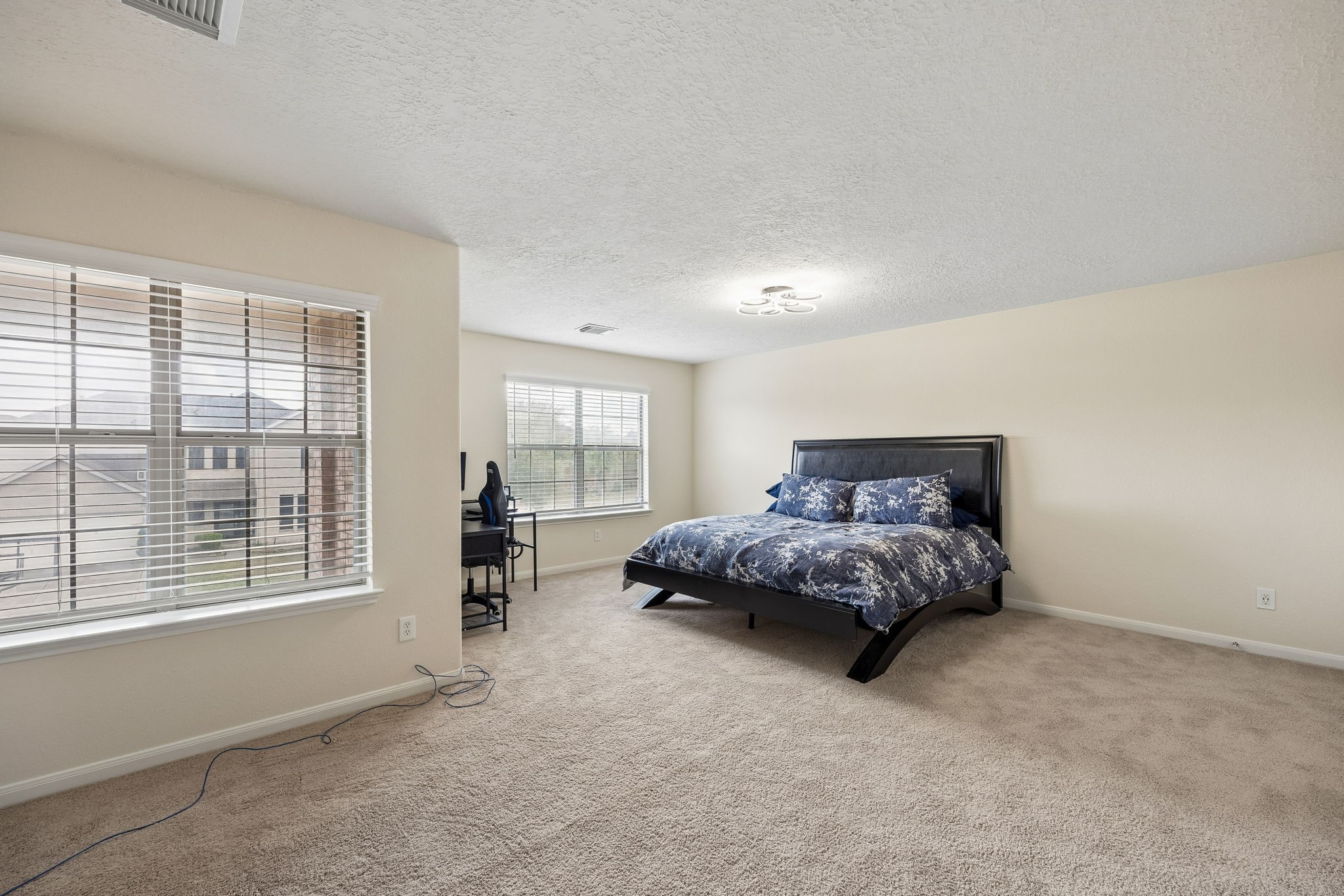 29711 Legends Green Drive Spring, TX 77386 - Photo 19 of 28 a bed sitting in a bedroom next to a window