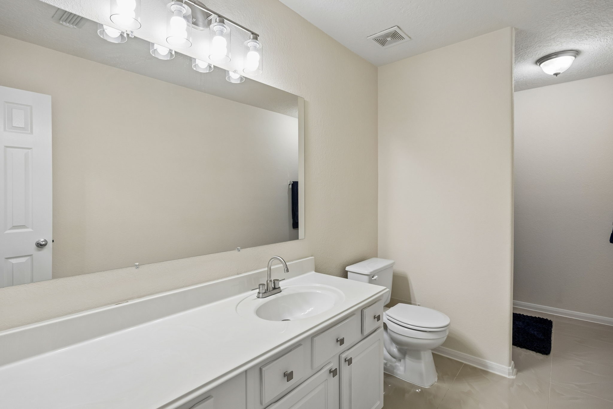 29711 Legends Green Drive Spring, TX 77386 - Photo 21 of 28 a bathroom with a sink a toilet and a mirror