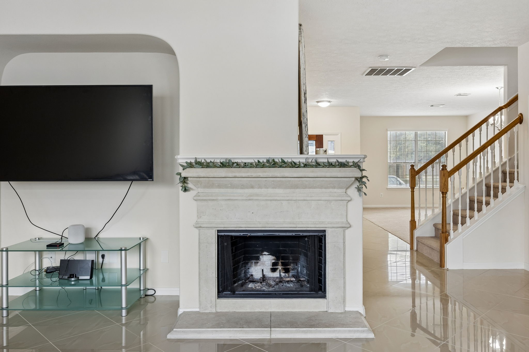 29711 Legends Green Drive Spring, TX 77386 - Photo 24 of 28 a living room with a fireplace and a flat screen tv