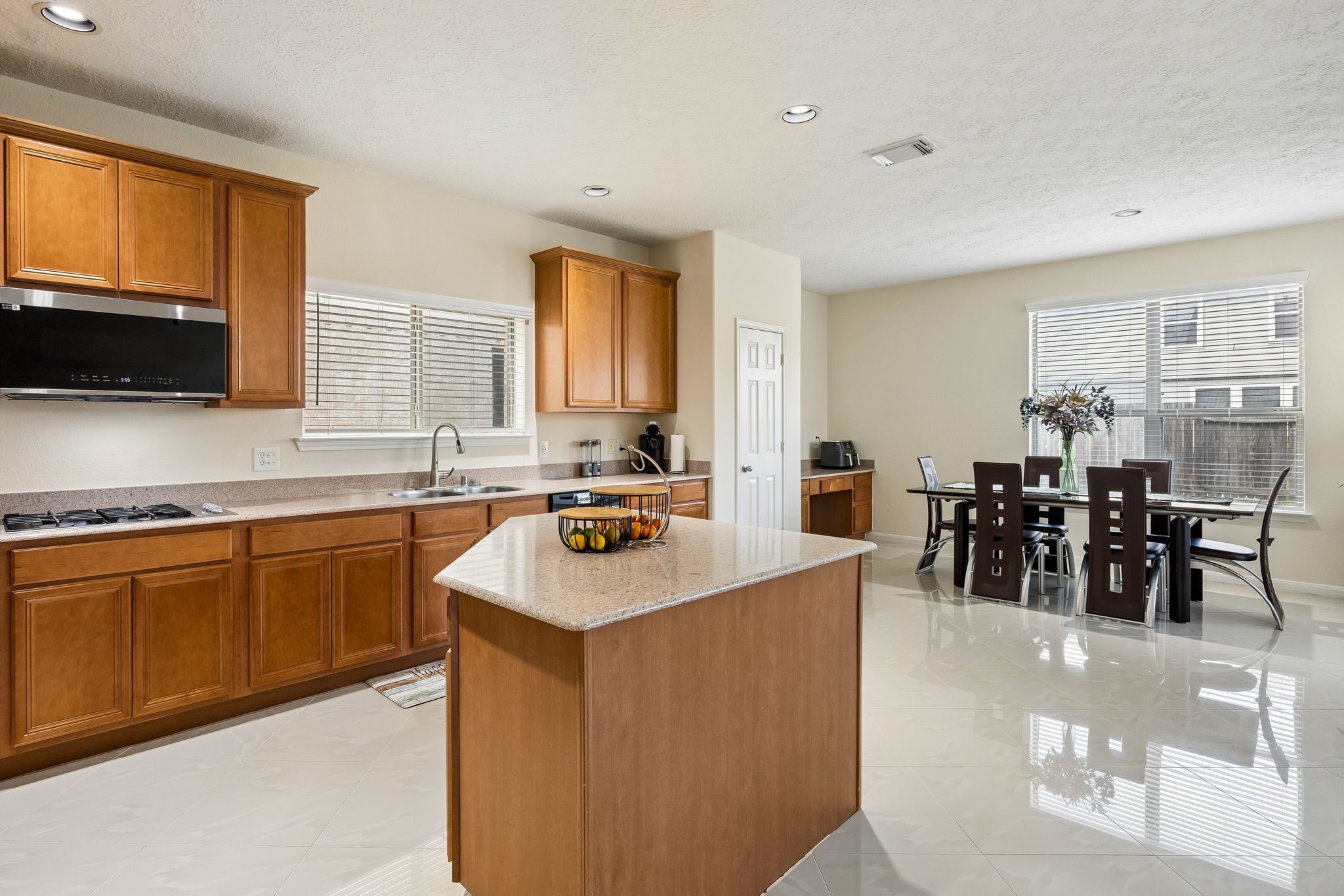 29711 Legends Green Drive Spring, TX 77386 - Photo 6 of 28 a kitchen with counter top space a sink appliances and cabinets