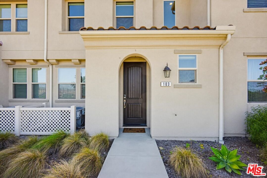 4105 Cameron Way, Unit 103 Corona, CA 92883 - Photo 1 of 30 a front view of a house with a garage