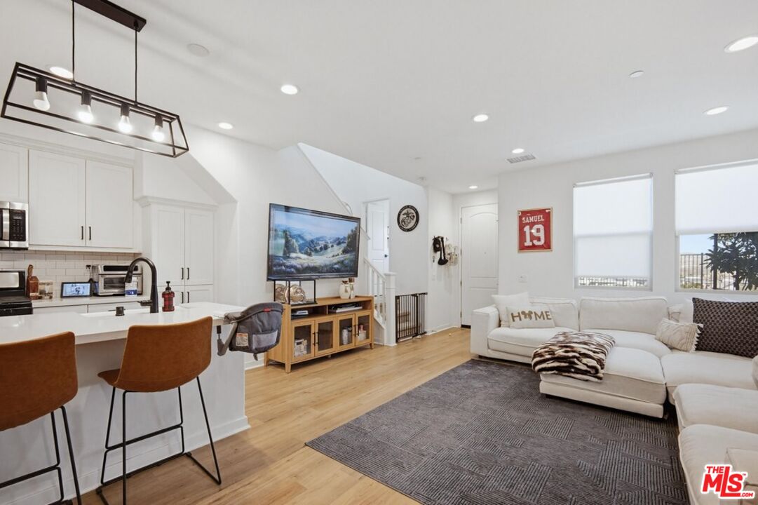 4105 Cameron Way, Unit 103 Corona, CA 92883 - Photo 12 of 30 a living room with furniture and a flat screen tv