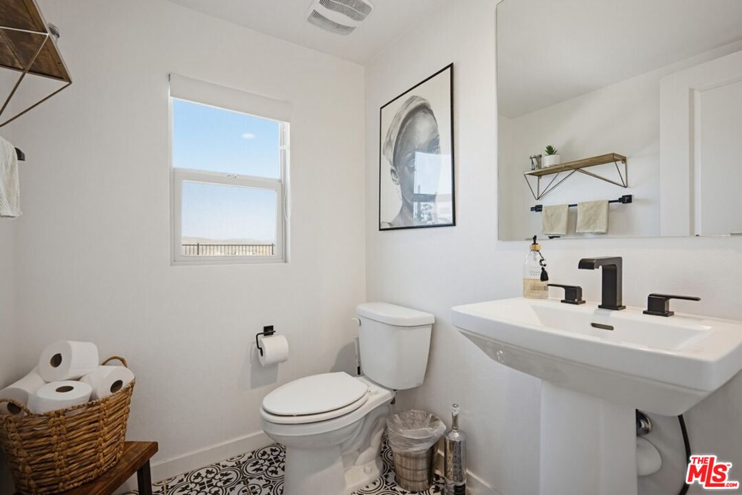 4105 Cameron Way, Unit 103 Corona, CA 92883 - Photo 13 of 30 a bathroom with a sink toilet and a mirror