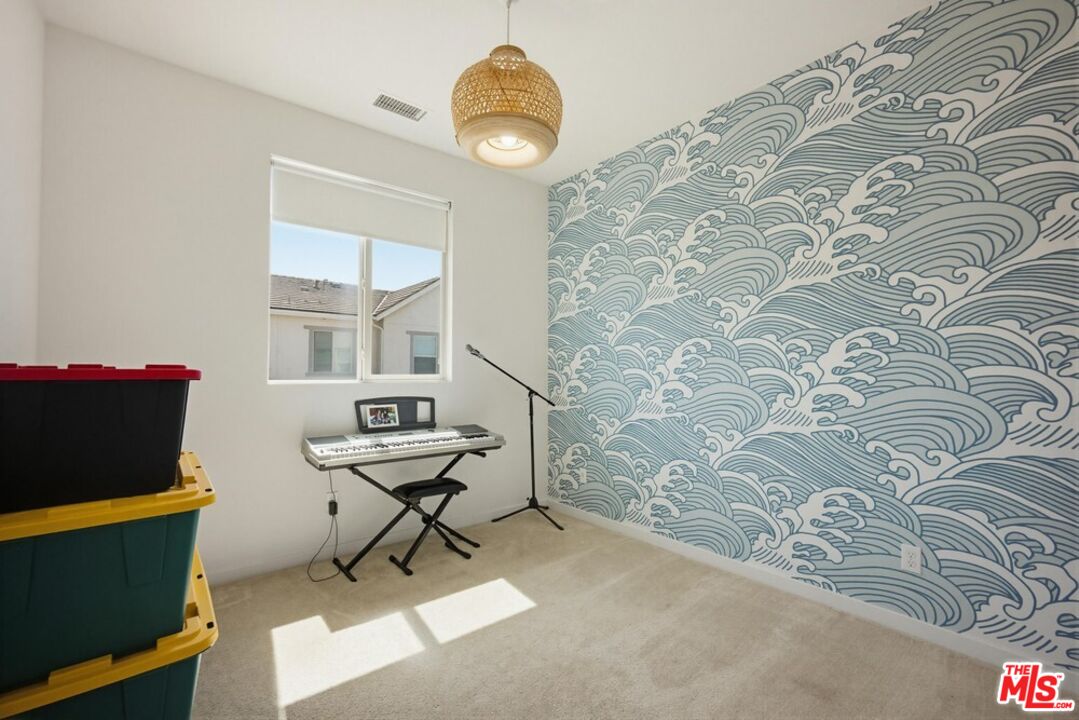 4105 Cameron Way, Unit 103 Corona, CA 92883 - Photo 23 of 30 a living room with a couch and a table