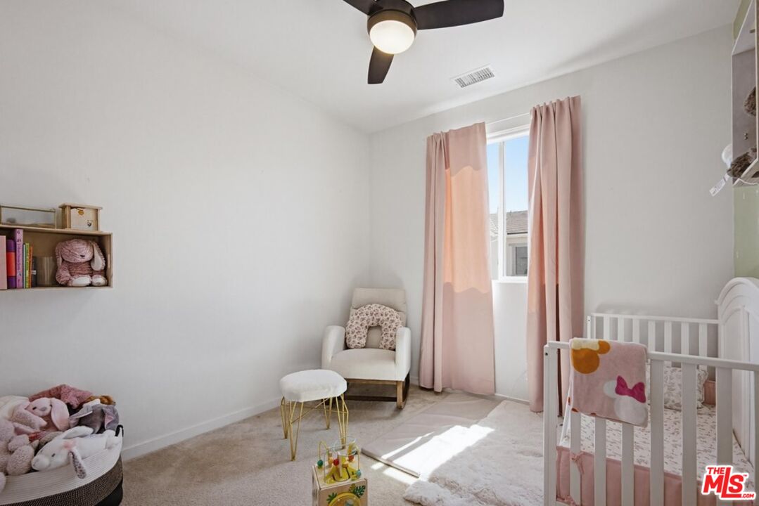 4105 Cameron Way, Unit 103 Corona, CA 92883 - Photo 25 of 30 a bedroom with furniture and a window