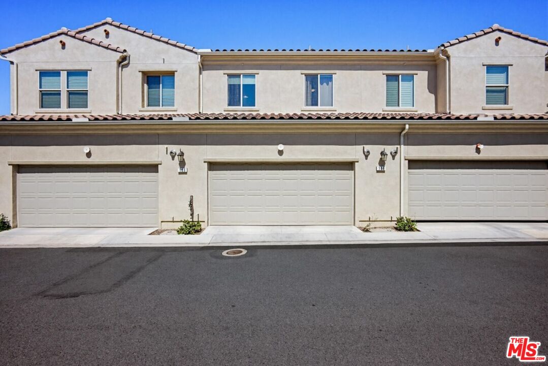 4105 Cameron Way, Unit 103 Corona, CA 92883 - Photo 27 of 30 a front view of a house with garage