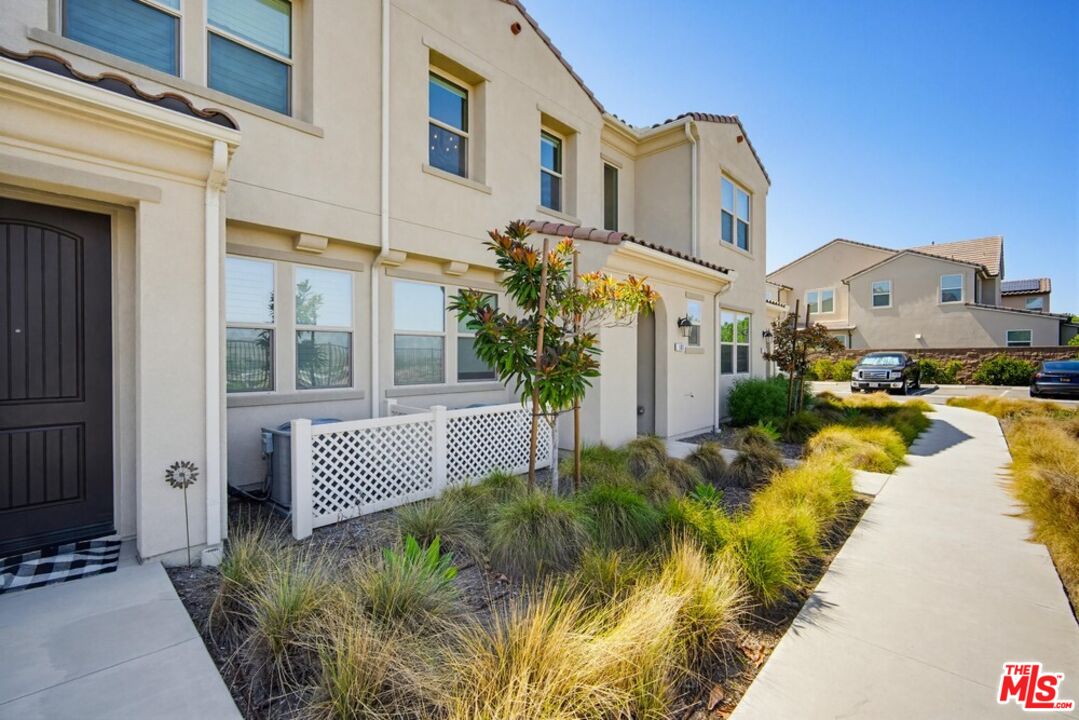 4105 Cameron Way, Unit 103 Corona, CA 92883 - Photo 3 of 30 a view of a house with a swimming pool