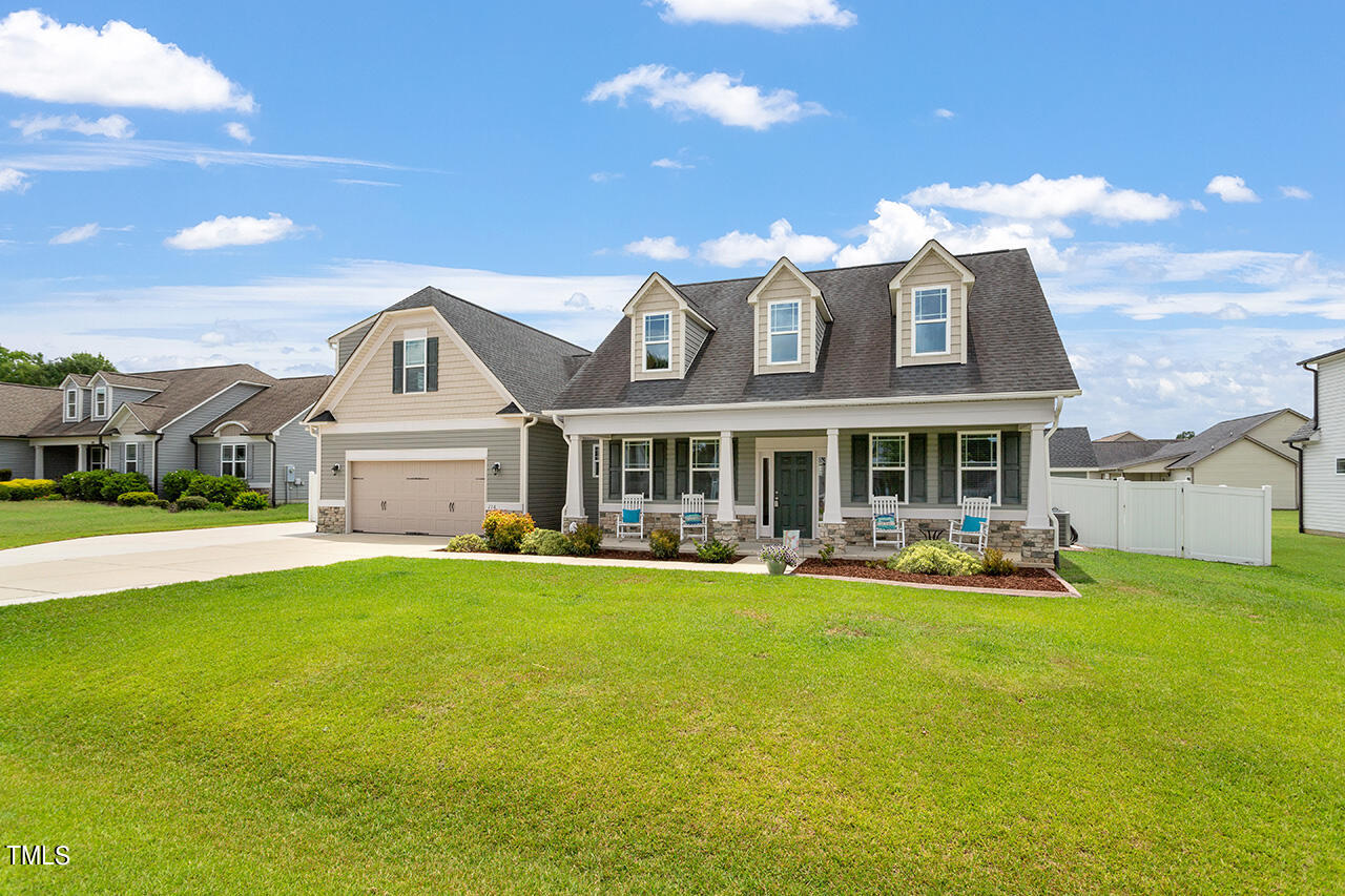 116 Celestial Drive Garner, NC 27529 - Photo 1 of 23 a front view of a house with swimming pool having outdoor seating