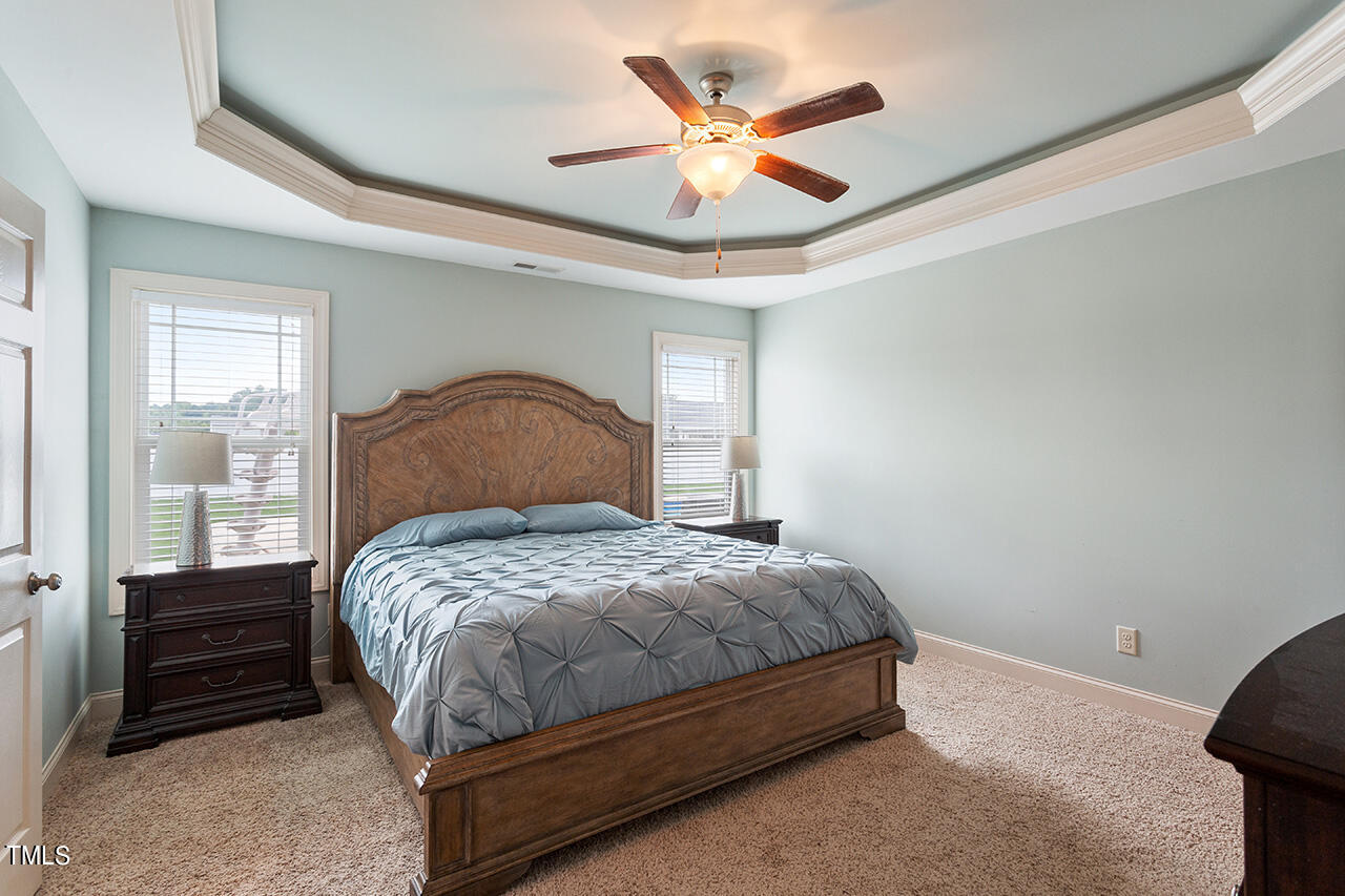 116 Celestial Drive Garner, NC 27529 - Photo 11 of 23 a bedroom with a bed and a large window