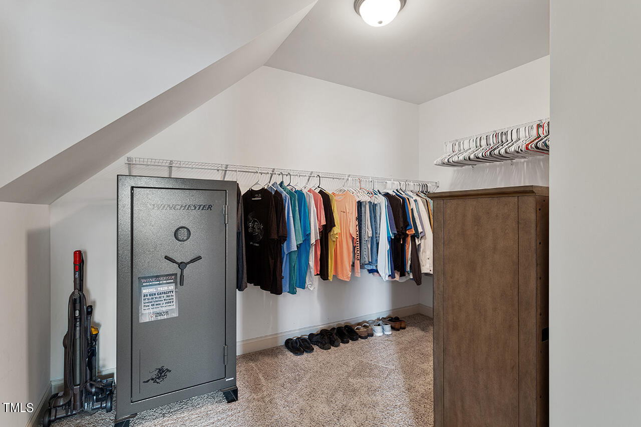 116 Celestial Drive Garner, NC 27529 - Photo 15 of 23 a view of walk in closet with clothes and shoes