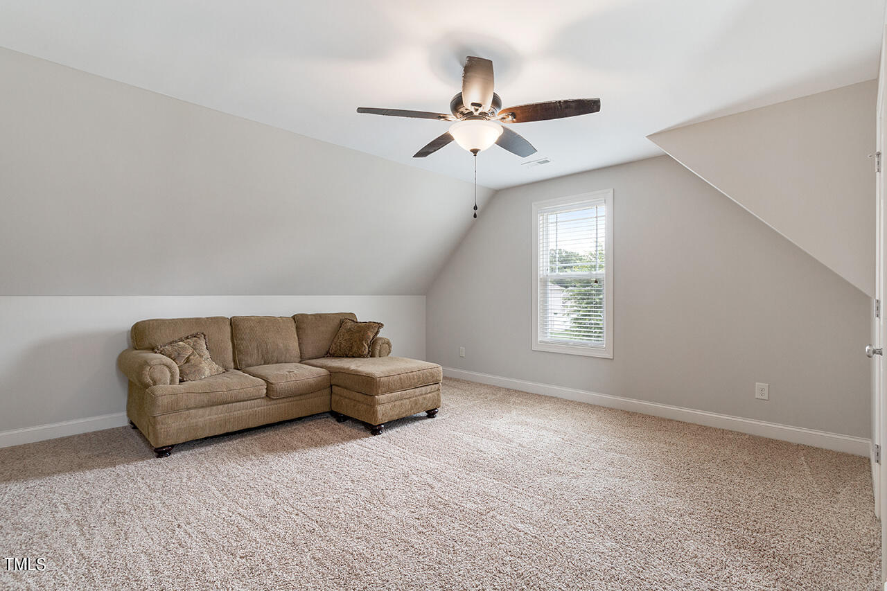 116 Celestial Drive Garner, NC 27529 - Photo 21 of 23 a living room with furniture and a window