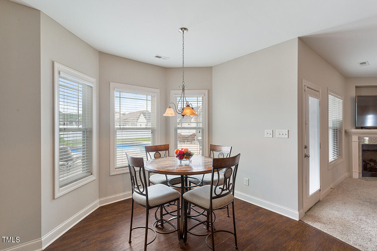116 Celestial Drive Garner, NC 27529 - Photo 10 of 23 a view of a dining room with furniture window and wooden floor